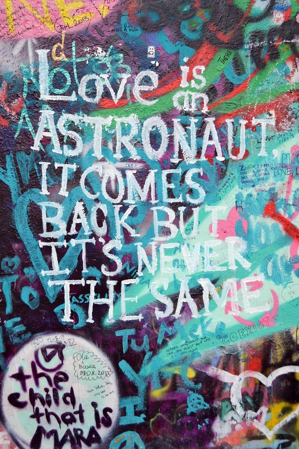 Love is an astronaut - love quotes at the John Lennon Wall in Prague, Czech Republic.